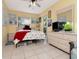 Bedroom with yellow walls, tile floors, ample natural light, and modern furnishings at 8326 40Th N Pl, St Petersburg, FL 33709
