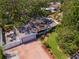 Aerial shot of a charming home with a brick driveway, manicured lawn, and attached garage at 8326 40Th N Pl, St Petersburg, FL 33709