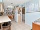 Spacious kitchen area with breakfast bar seating, neutral cabinets, and modern appliances for convenient cooking at 8326 40Th N Pl, St Petersburg, FL 33709