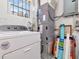 Practical utility room with a washing machine, dryer, and mechanical equipment at 8326 40Th N Pl, St Petersburg, FL 33709