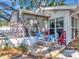 Charming patio with screened-in porch, seating, and a view of the backyard at 8326 40Th N Pl, St Petersburg, FL 33709