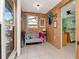 Comfortable sitting area with paneled walls, neutral sofa, and decorative accents at 8326 40Th N Pl, St Petersburg, FL 33709