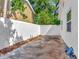 Enclosed yard with a white privacy wall for a secluded outdoor space at 8326 40Th N Pl, St Petersburg, FL 33709