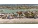 Expansive aerial view showcases beachfront property on a picturesque shoreline, ideal for coastal living at 8403 W Gulf Blvd, Treasure Island, FL 33706
