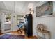 Inviting entryway with a black chest of drawers, director's chair, and tropical-themed decor at 8403 W Gulf Blvd, Treasure Island, FL 33706