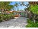 Inviting front porch with comfortable seating, perfect for enjoying the vibrant outdoor ambiance of the property at 8403 W Gulf Blvd, Treasure Island, FL 33706