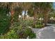 Lush tropical landscaping frames this charming home, creating a serene and private oasis at 8403 W Gulf Blvd, Treasure Island, FL 33706
