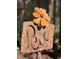 Rustic metal garden art featuring a 'Peace' sign with a cheerful flower accent at 8403 W Gulf Blvd, Treasure Island, FL 33706