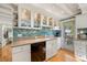 Stylish kitchen with tiled backsplash, granite countertops, and stainless steel appliances at 8403 W Gulf Blvd, Treasure Island, FL 33706
