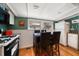 Cozy eat-in kitchen features stainless appliances, hardwood floors, and lots of natural light at 8403 W Gulf Blvd, Treasure Island, FL 33706