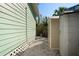 Exterior shot with a storage shed tucked away on the side of the house, providing extra storage space at 8403 W Gulf Blvd, Treasure Island, FL 33706