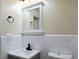 Renovated bathroom featuring gray vanity, white tile backsplash, and modern fixtures at 8719 Sunlit Cove Ne Dr, St Petersburg, FL 33702
