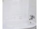 All-white tiled bathtub and shower area with chrome fixtures at 8719 Sunlit Cove Ne Dr, St Petersburg, FL 33702