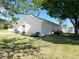 Charming home exterior featuring a well-manicured lawn and lush landscaping at 8719 Sunlit Cove Ne Dr, St Petersburg, FL 33702
