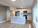Stylish kitchen with white cabinets, marble backsplash, and a stainless steel refrigerator at 8719 Sunlit Cove Ne Dr, St Petersburg, FL 33702