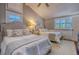 Bedroom featuring two beds with gray headboards, lots of windows, and a ceiling fan at 898 Cypress Lakeview Ct, Tarpon Springs, FL 34688