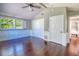 Bedroom with hardwood floors, wainscoting, and lots of closet space at 898 Cypress Lakeview Ct, Tarpon Springs, FL 34688