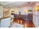 Elegant dining room features custom cabinetry, stylish lighting, and beautiful hardwood flooring at 898 Cypress Lakeview Ct, Tarpon Springs, FL 34688