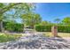 View down the tree lined driveway, from the road at 898 Cypress Lakeview Ct, Tarpon Springs, FL 34688
