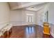 Bright foyer with hardwood floors, wainscoting, and a decorative glass front door at 898 Cypress Lakeview Ct, Tarpon Springs, FL 34688