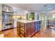 Kitchen island featuring granite countertop, dark cabinets, and stainless steel appliances, including a Viking stove at 898 Cypress Lakeview Ct, Tarpon Springs, FL 34688
