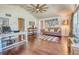 Inviting living room with hardwood floors, neutral paint, and comfortable seating at 898 Cypress Lakeview Ct, Tarpon Springs, FL 34688
