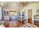 Comfortable living room boasts hardwood floors, vaulted ceilings, and natural light at 898 Cypress Lakeview Ct, Tarpon Springs, FL 34688
