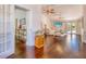 Spacious living room with hardwood floors and an open floor plan into the front entry at 898 Cypress Lakeview Ct, Tarpon Springs, FL 34688