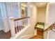 Staircase leading to an upper level, with a small bar area with cabinets visible in the lower level at 898 Cypress Lakeview Ct, Tarpon Springs, FL 34688