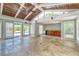 Spacious sunroom with a wood-paneled ceiling, travertine floors, and a bar area overlooking the pool at 898 Cypress Lakeview Ct, Tarpon Springs, FL 34688