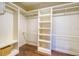 Spacious walk-in closet with ample shelving and storage at 898 Cypress Lakeview Ct, Tarpon Springs, FL 34688