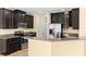 Modern kitchen featuring stainless steel appliances and granite countertops at 9908 Spice Bush Ct, Tampa, FL 33647