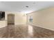 Open-concept living room featuring tile flooring and lots of natural light at 9908 Spice Bush Ct, Tampa, FL 33647