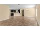 Open living room with sleek tile flooring and neutral walls at 9908 Spice Bush Ct, Tampa, FL 33647