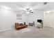 Cozy bedroom with a comfortable futon, neutral decor, and a well-lit study area, perfect for relaxation at 10687 Lake Montauk Dr, Riverview, FL 33578