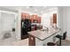 Well-equipped kitchen with stainless steel appliances and granite countertops at 10687 Lake Montauk Dr, Riverview, FL 33578