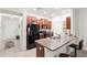 Well-equipped kitchen with stainless steel appliances and granite countertops at 10687 Lake Montauk Dr, Riverview, FL 33578