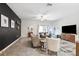 Spacious living area featuring tile floors, contemporary decor, and ample natural light at 10687 Lake Montauk Dr, Riverview, FL 33578