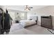 Bright bedroom with large windows, a comfortable bed, and functional furniture, creating a serene retreat at 10687 Lake Montauk Dr, Riverview, FL 33578