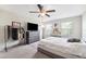 Bedroom featuring a ceiling fan, plenty of natural light, and a spacious layout, creating a relaxing ambiance at 10687 Lake Montauk Dr, Riverview, FL 33578