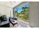 Screened patio with outdoor furniture, offering a peaceful view of the surrounding greenery at 10687 Lake Montauk Dr, Riverview, FL 33578