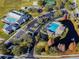 Community aerial view showcasing swimming pools, tennis courts, clubhouse, and lush landscaping in a well-planned neighborhood at 10807 Keys Gate Dr, Riverview, FL 33579