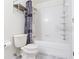 Bathroom with tiled shower and toilet at 10807 Keys Gate Dr, Riverview, FL 33579