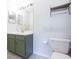 Updated bathroom with green vanity and mirror at 10807 Keys Gate Dr, Riverview, FL 33579
