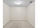 This is an empty bedroom with neutral walls, carpet, and a ceiling light at 10807 Keys Gate Dr, Riverview, FL 33579