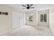 This is a bedroom with neutral walls, a ceiling fan, and a double door closet at 10807 Keys Gate Dr, Riverview, FL 33579