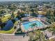 Aerial view of the community pool with lake and pool house at 10807 Keys Gate Dr, Riverview, FL 33579