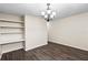 Dining room with hardwood floors, a chandelier, and a built-in desk at 10807 Keys Gate Dr, Riverview, FL 33579