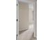 View of the hallway with neutral walls and carpets leading to a bedroom at 10807 Keys Gate Dr, Riverview, FL 33579