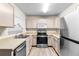 A well-lit kitchen showcases stainless steel appliances and warm countertops at 10807 Keys Gate Dr, Riverview, FL 33579